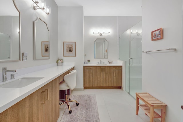 bathroom featuring vanity, tile patterned floors, and walk in shower