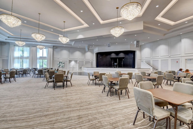 carpeted dining area featuring crown molding and a raised ceiling