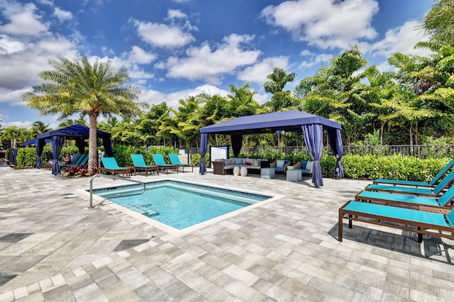 view of pool featuring a gazebo, an outdoor hangout area, and a patio area