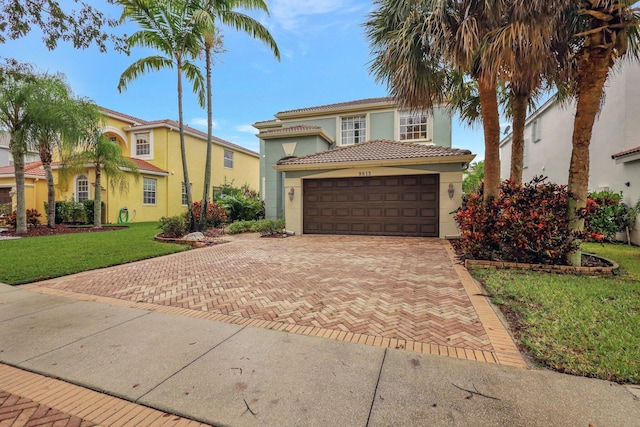 mediterranean / spanish-style house with a front yard and a garage