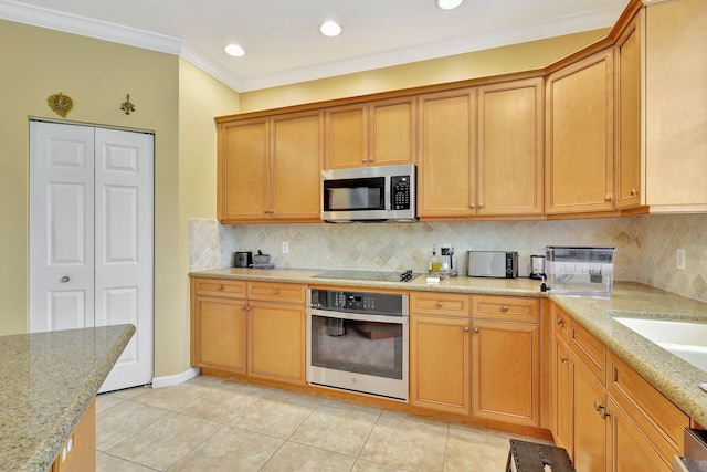 kitchen with light tile patterned flooring, crown molding, decorative backsplash, and stainless steel appliances