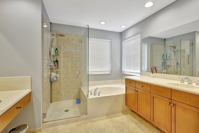 bathroom with vanity, plus walk in shower, and tile patterned floors