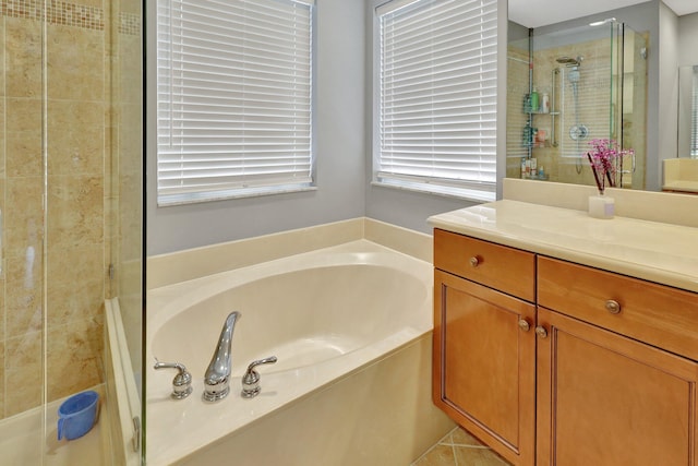 bathroom featuring independent shower and bath and vanity