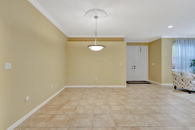 tiled empty room featuring crown molding