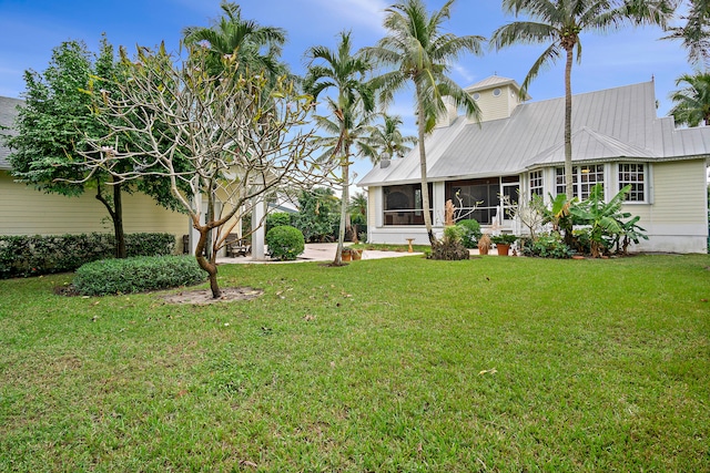 view of yard with a sunroom