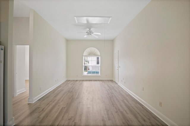 empty room with light hardwood / wood-style flooring and ceiling fan