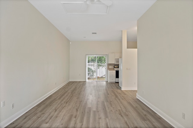 unfurnished living room with light wood-type flooring