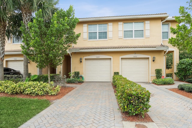 5818 Monterra Club Dr, Lake Worth, FL 33463 - multi unit property with an attached garage, a tiled roof, driveway, and stucco siding