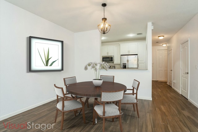 dining space with an inviting chandelier, visible vents, dark wood-style floors, and baseboards