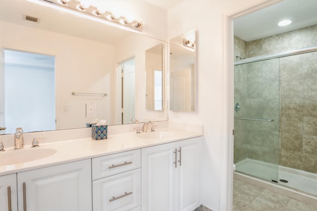 bathroom with walk in shower, vanity, toilet, and tile patterned floors