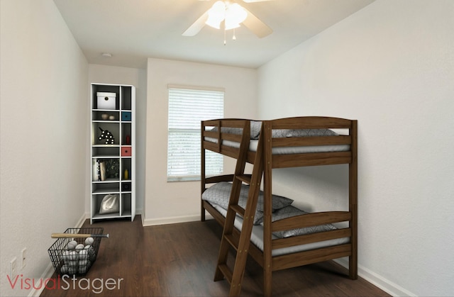 bedroom featuring baseboards and dark wood-style floors