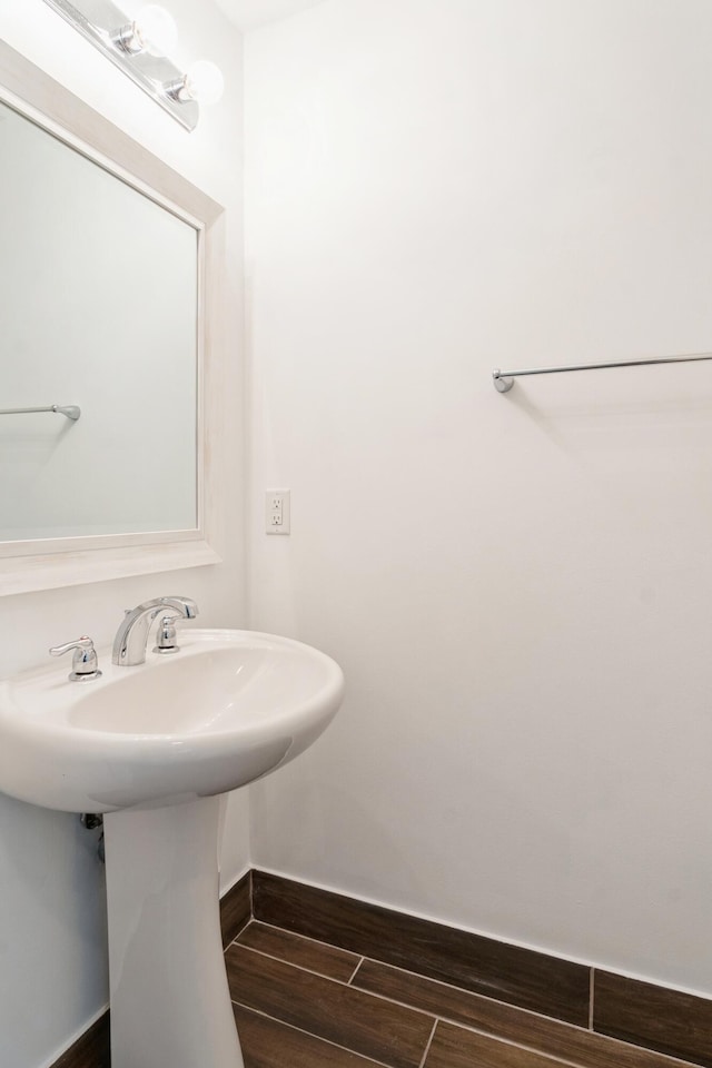 bathroom with sink and hardwood / wood-style floors