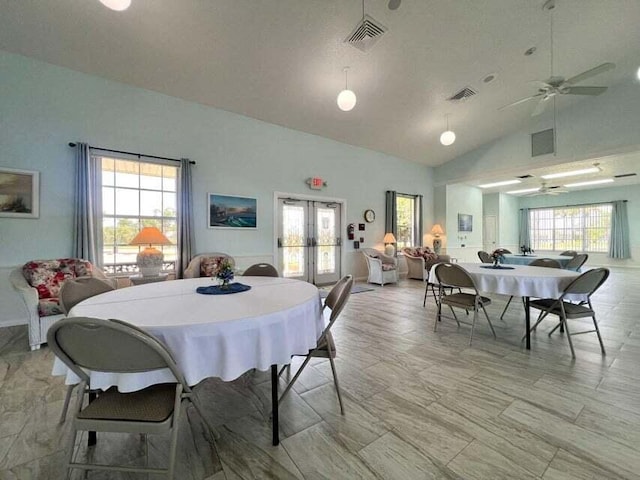 dining area with a healthy amount of sunlight, ceiling fan, and french doors