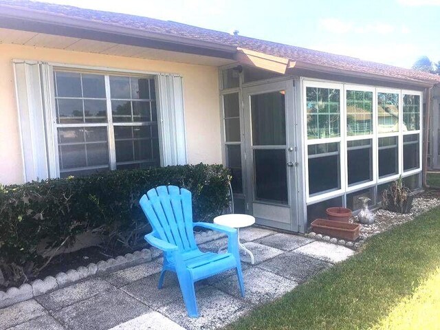 exterior space featuring a sunroom