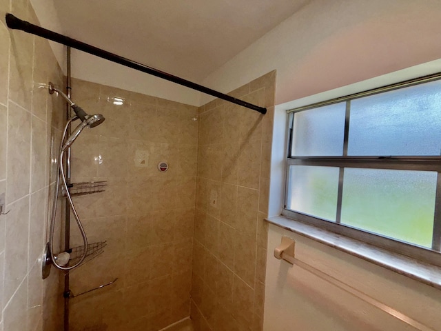 full bathroom featuring a tile shower