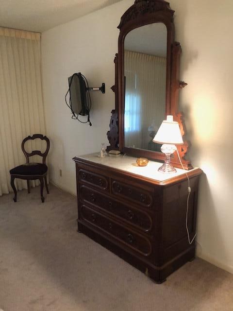 bedroom with light colored carpet