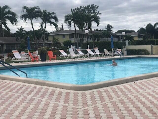 view of swimming pool with a patio