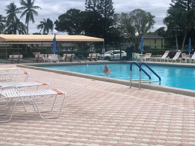 view of swimming pool with a patio