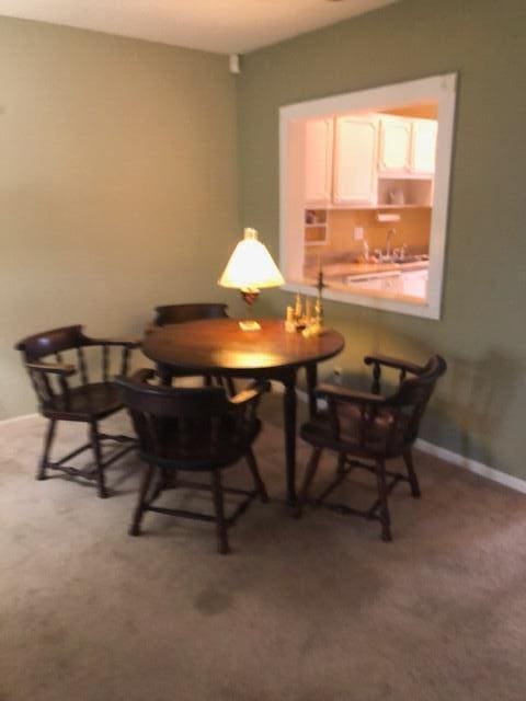 view of carpeted dining space