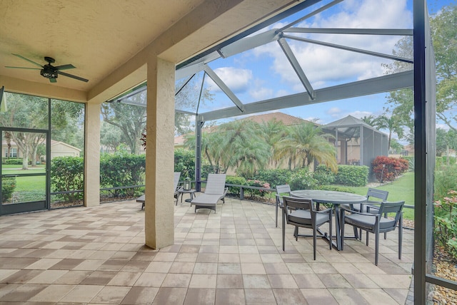 view of patio / terrace with glass enclosure and ceiling fan