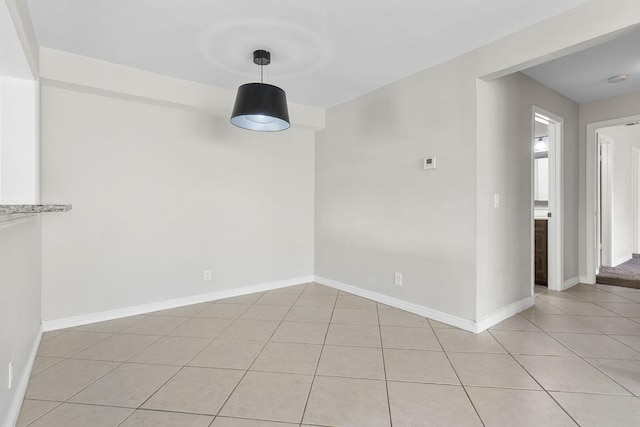 spare room with light tile patterned floors