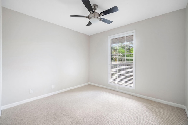 carpeted empty room with ceiling fan