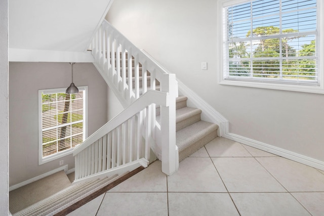 staircase with tile patterned floors