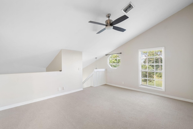 bonus room with carpet floors, ceiling fan, and lofted ceiling