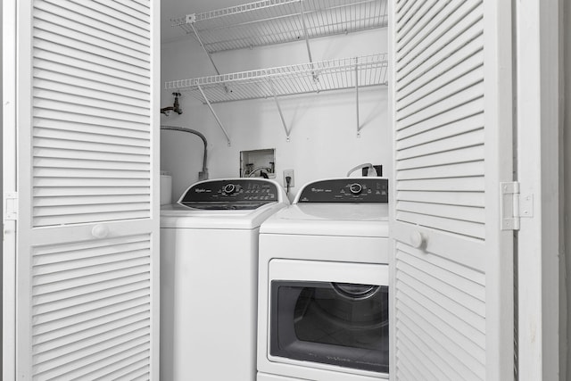 laundry room with washer and clothes dryer