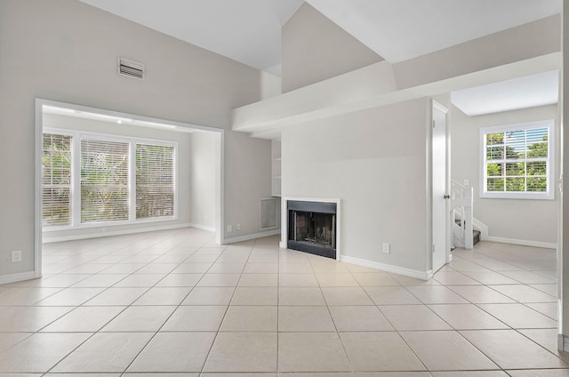 unfurnished living room featuring light tile patterned flooring