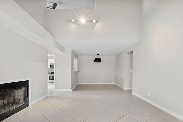 unfurnished living room with light tile patterned floors