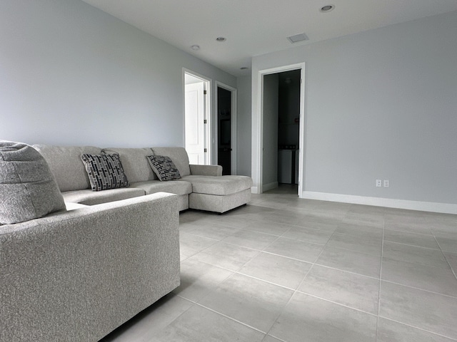 living room with light tile patterned floors