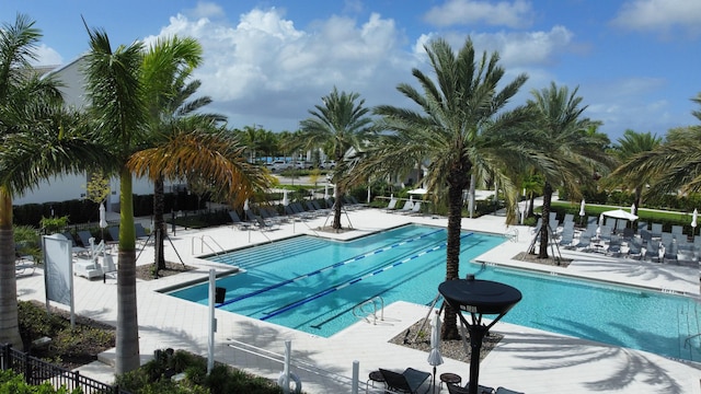 view of swimming pool with a patio