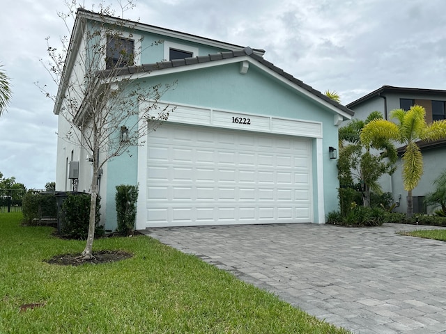 garage featuring a yard