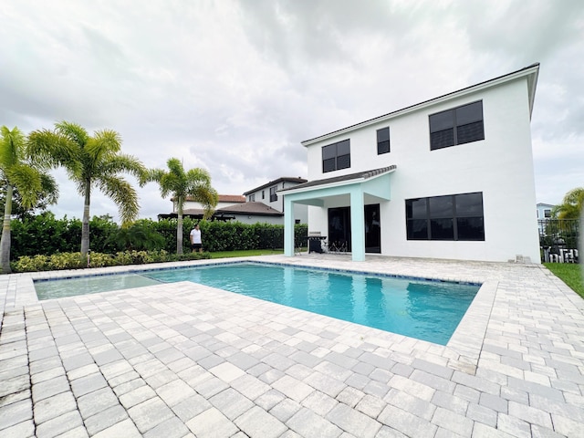 view of swimming pool featuring a patio area