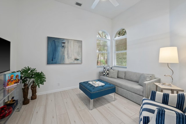 4561 Carlton Golf Dr, Lake Worth, FL 33449 - living area with wood finished floors, visible vents, baseboards, high vaulted ceiling, and ceiling fan