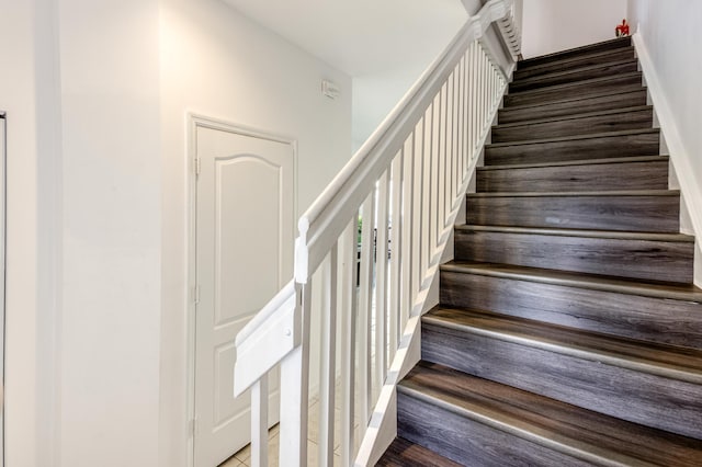 stairway featuring hardwood / wood-style flooring