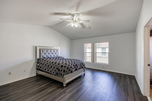 bedroom with dark hardwood / wood-style floors, ceiling fan, and lofted ceiling