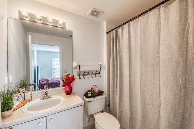 bathroom featuring hardwood / wood-style floors and vanity