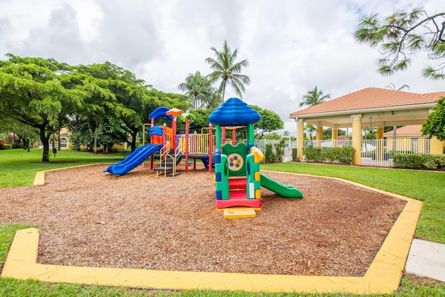 view of jungle gym featuring a lawn