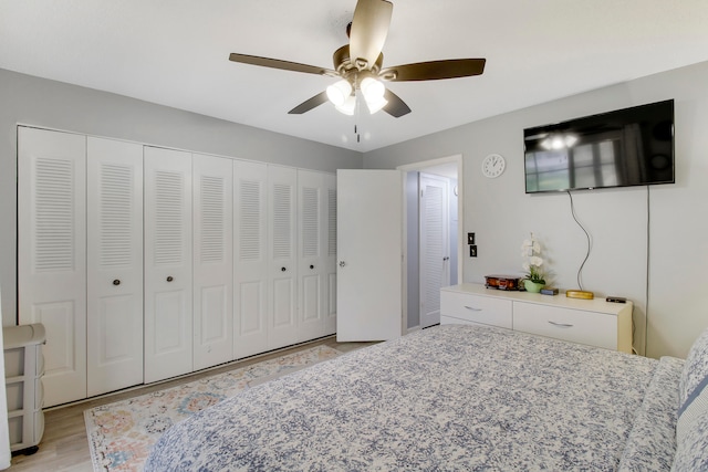 bedroom featuring light wood-type flooring and ceiling fan