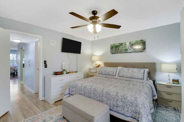 bedroom featuring light hardwood / wood-style flooring and ceiling fan