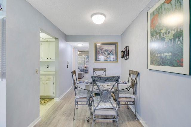 dining space featuring light hardwood / wood-style flooring