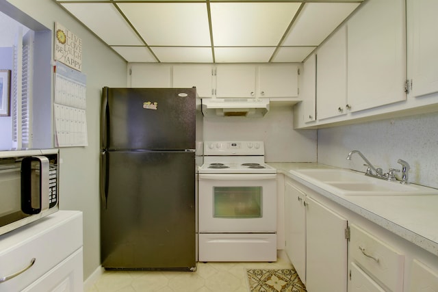 kitchen with a drop ceiling, white range with electric cooktop, sink, white cabinets, and black refrigerator