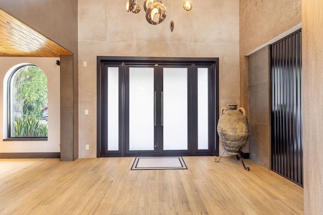 foyer entrance with light hardwood / wood-style floors