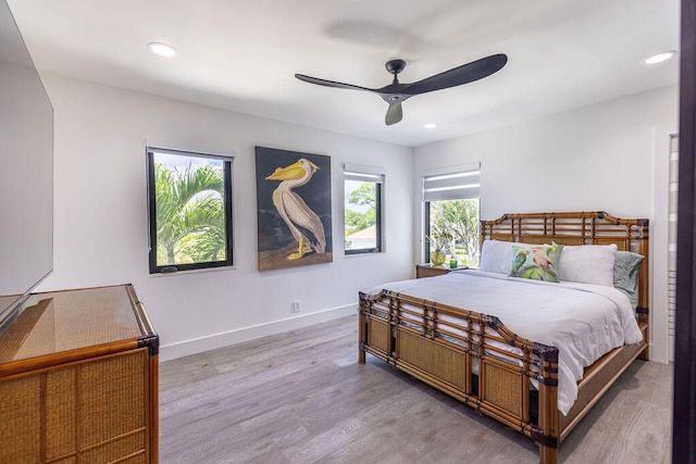 bedroom with ceiling fan and hardwood / wood-style floors