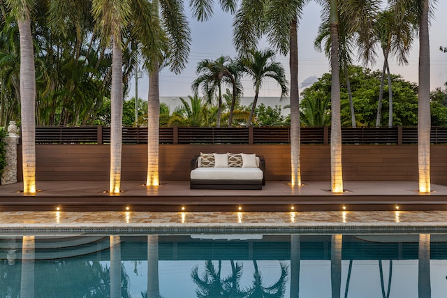 view of pool at dusk