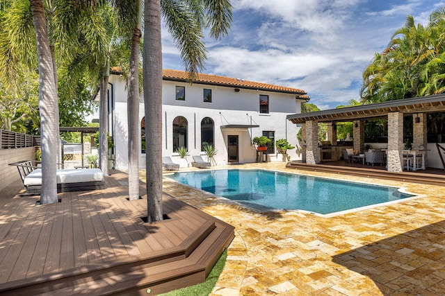 view of swimming pool with a wooden deck