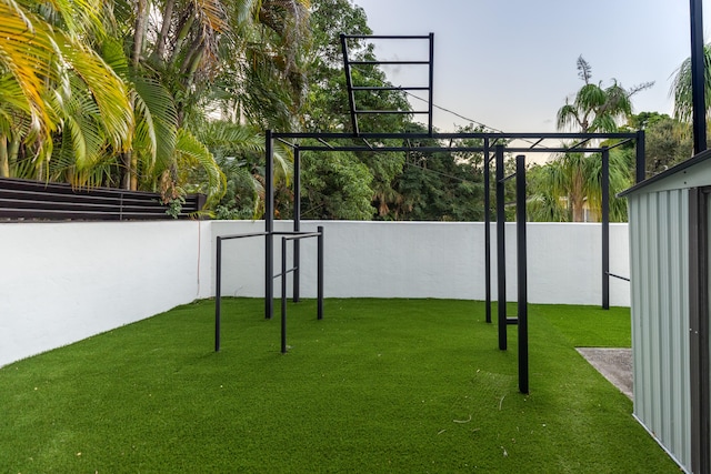 view of jungle gym with a lawn