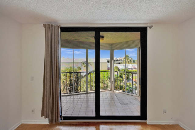 doorway featuring a textured ceiling